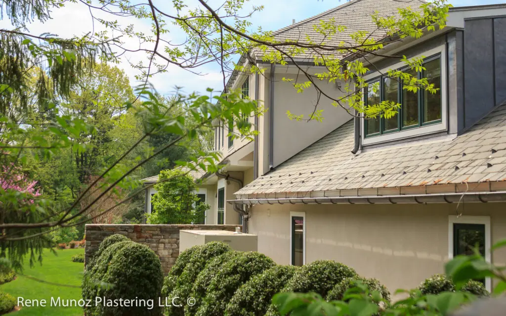 beautiful, stucco 3 coats installation in a tan stucco color finish